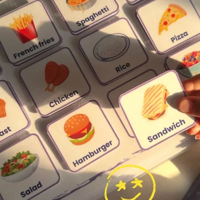 A girl matching a sandwich card with the English food cards in My Words